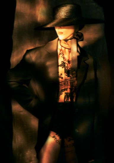 Fashion photo of a woman in an outfit inspired by Sherlock Holmes.
