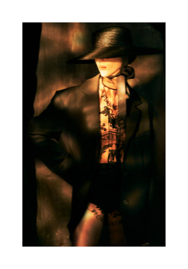 Fashion photo of a woman in an outfit inspired by Sherlock Holmes.