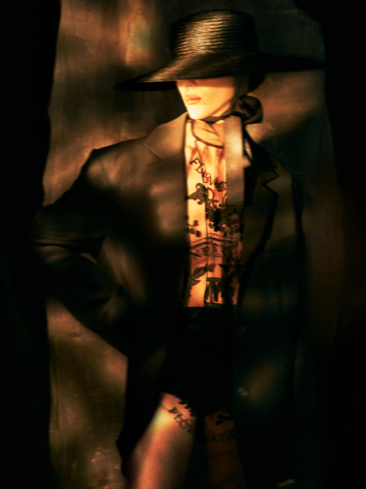 Fashion photo of a woman in an outfit inspired by Sherlock Holmes.