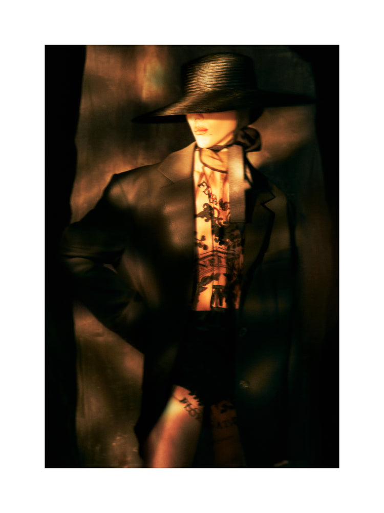 Fashion photo of a woman in an outfit inspired by Sherlock Holmes.