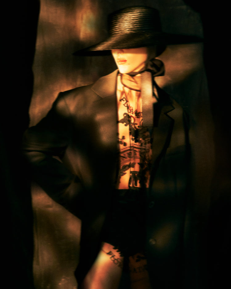 Fashion photo of a woman in an outfit inspired by Sherlock Holmes.