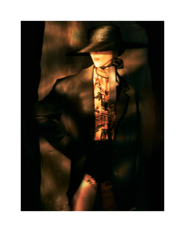 Fashion photo of a woman in an outfit inspired by Sherlock Holmes.