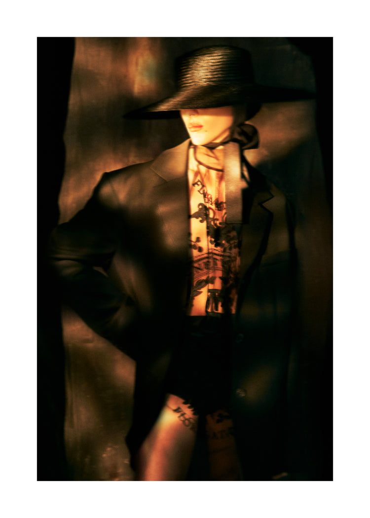 Fashion photo of a woman in an outfit inspired by Sherlock Holmes.