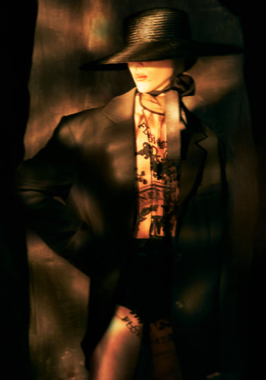 Fashion photo of a woman in an outfit inspired by Sherlock Holmes.