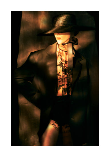 Fashion photo of a woman in an outfit inspired by Sherlock Holmes.