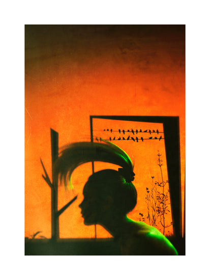 A woman with a ponytail doing a hair flip in an orange room.