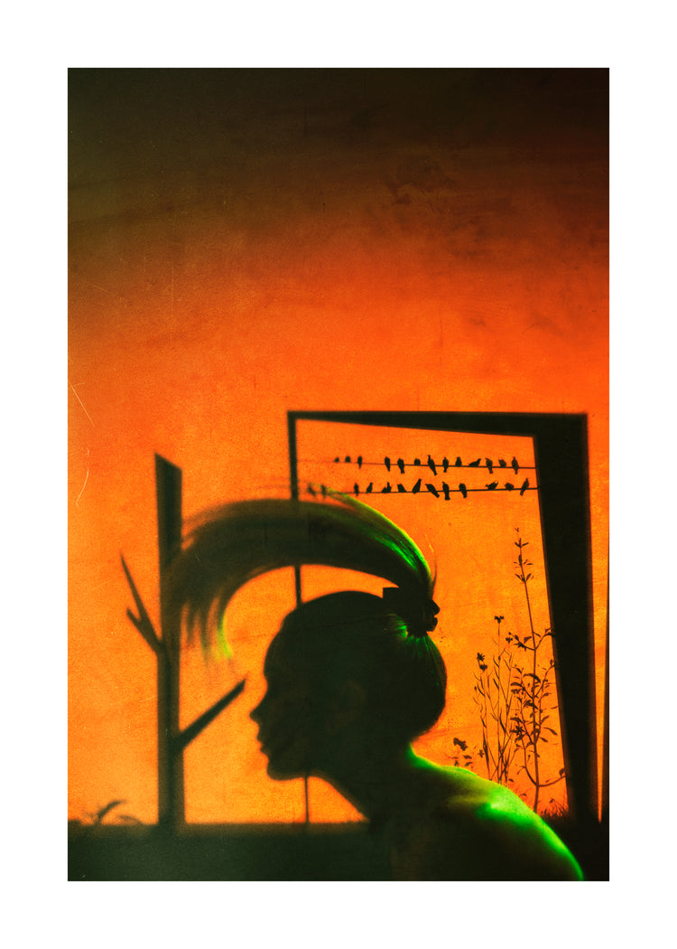 A woman with a ponytail doing a hair flip in an orange room.