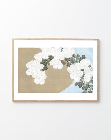 Framed artwork with white flowers on a beige and blue background