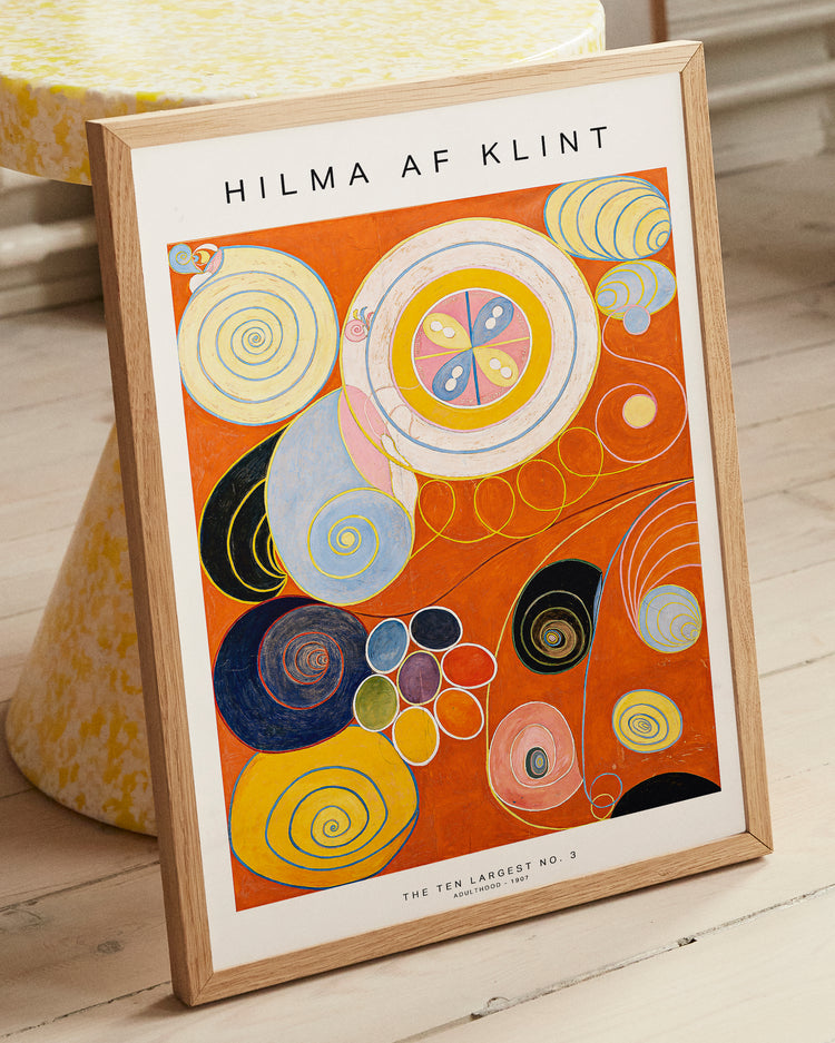Framed Hilma af Klint artwork on a wooden floor