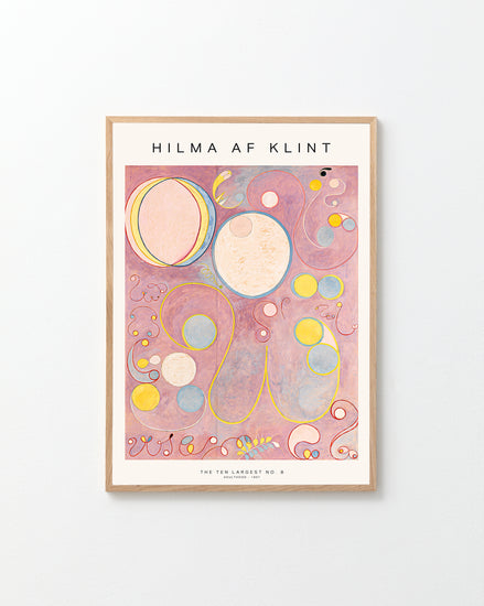Framed abstract artwork with geometric shapes on a pink background, featuring the artist's name 'Hilma af Klint'.
