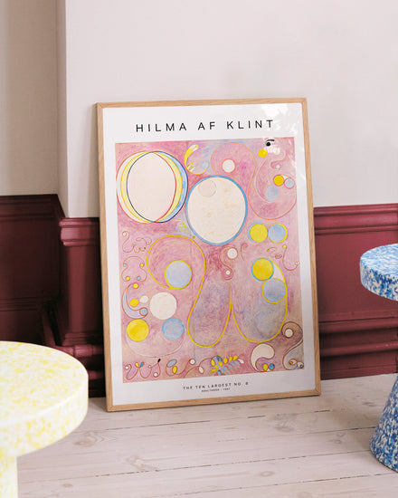 Framed Hilma af Klint artwork on a wall with decorative elements.