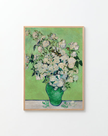 Framed artwork of a bouquet of flowers in a green vase on a light green background