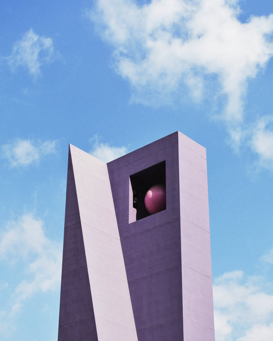 The Pershing Square Tower Poster captures a tall, modern concrete structure with angular design against a blue sky. A large pink sphere is suspended near the top, while wispy clouds reminiscent of Hanna KLs artistic palette scatter in the background.