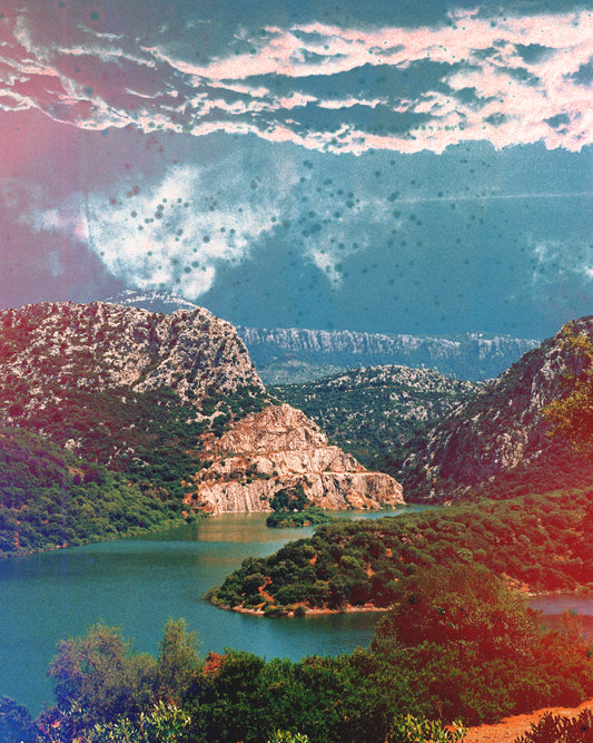 Canyon scenery with mountains covered in lush green forest and a blue river.