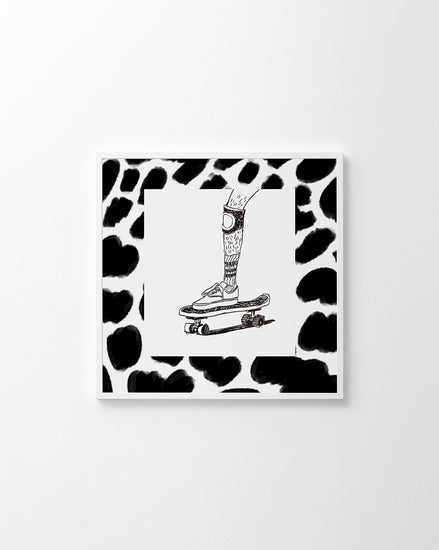 Skater wearing Vans and a kneepad framed in a black and white pattern.