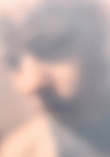 Blurry profile portrait created by using light and shadows to create contrasts.