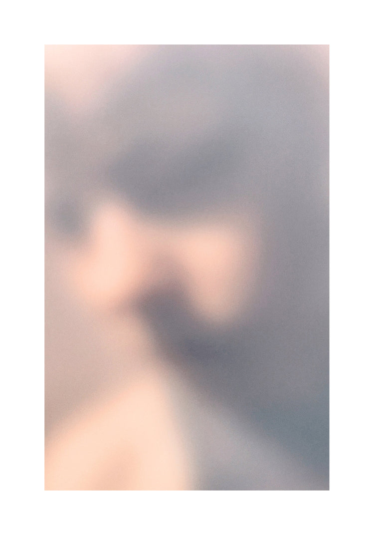 Blurry profile portrait created by using light and shadows to create contrasts.