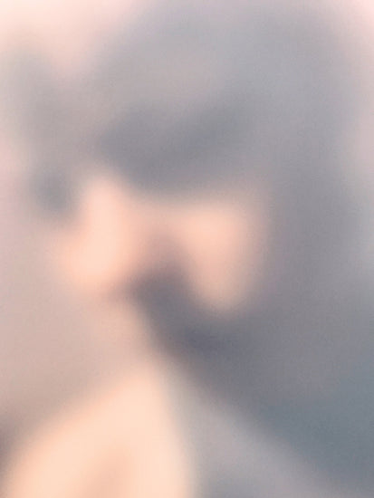 Blurry profile portrait created by using light and shadows to create contrasts.