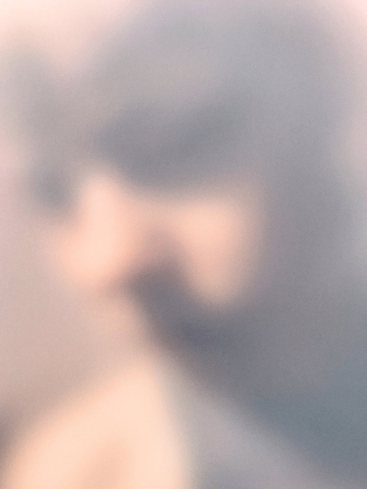 Blurry profile portrait created by using light and shadows to create contrasts.