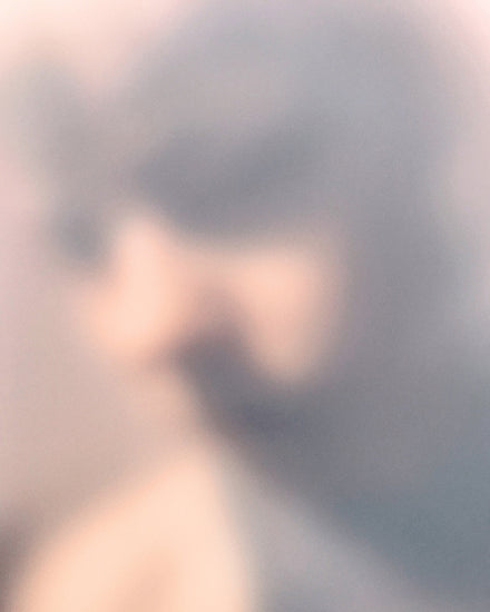 Blurry profile portrait created by using light and shadows to create contrasts.