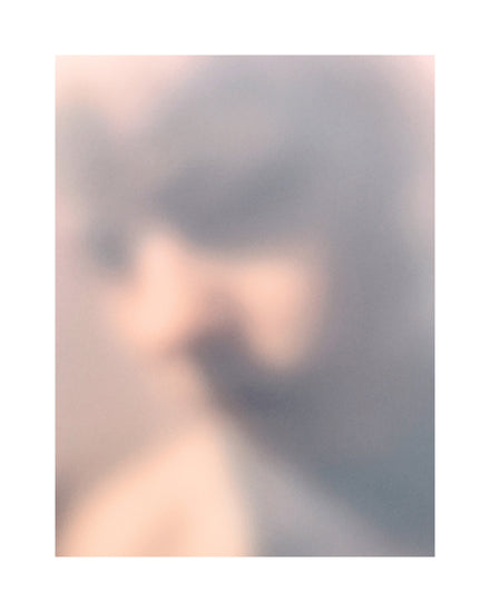 Blurry profile portrait created by using light and shadows to create contrasts.