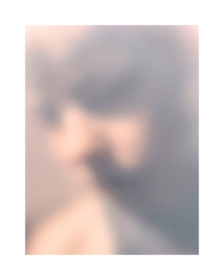 Blurry profile portrait created by using light and shadows to create contrasts.