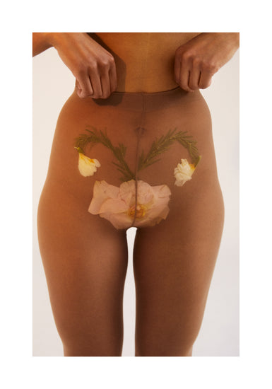 A woman in transparent stockings with a flower symbolizing her uterus.