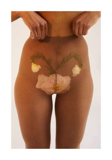 A woman in transparent stockings with a flower symbolizing her uterus.