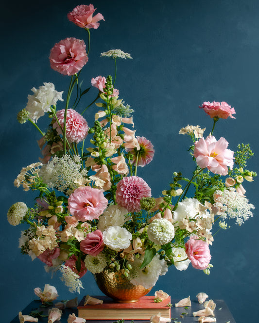 The Midsummer Poster showcases a lush flower arrangement in a vase set against a dark teal background, featuring pink and white peonies, dahlias, and lisianthus with greenery and delicate white accents for an elegant and fresh display.