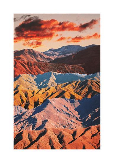 Mountain ranges in different colors creating natural lines in a barren landscape.