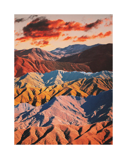 Mountain ranges in different colors creating natural lines in a barren landscape.