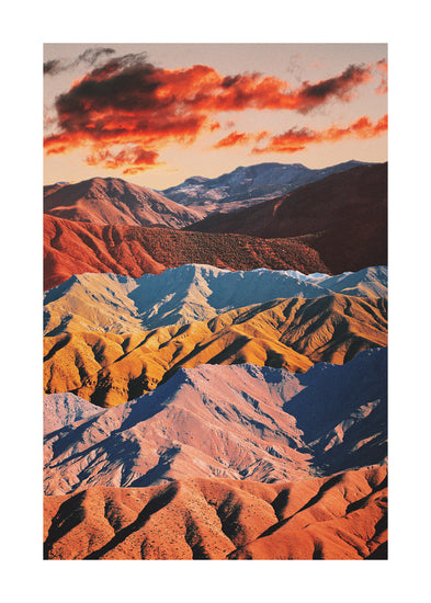 Mountain ranges in different colors creating natural lines in a barren landscape.