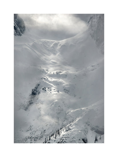 A barren mountain side covered in snow and ice.