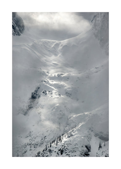 A barren mountain side covered in snow and ice.