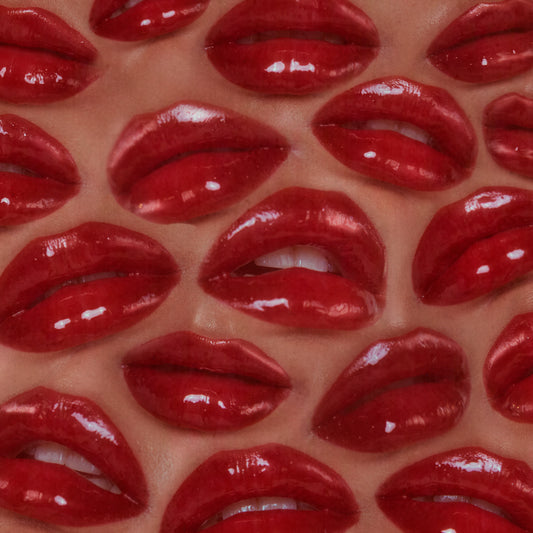 A pattern made from a bunch of shiny red lips.