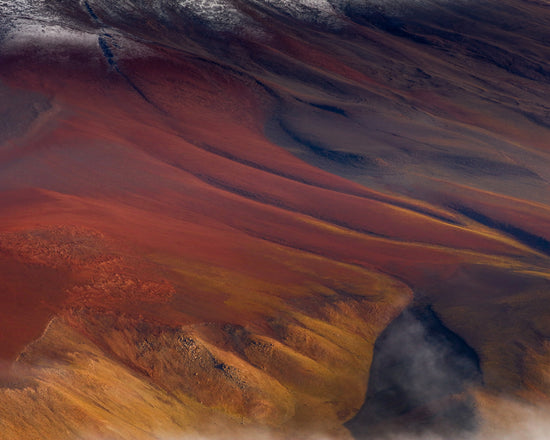 Mountain scenery full of minerals looking like a crater on mars.