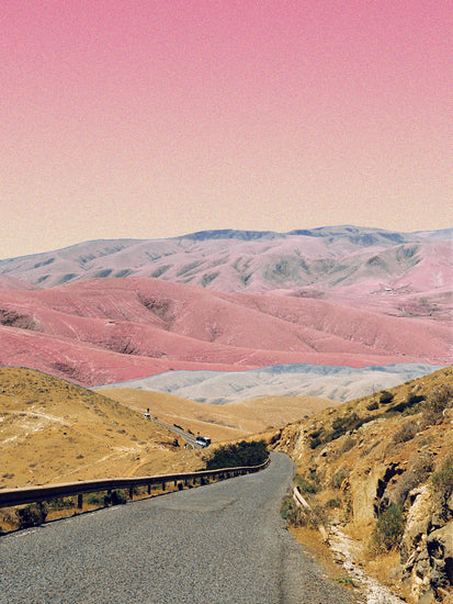 Technicolor scenic landscape with pink and purple mountains under a pink sky.
