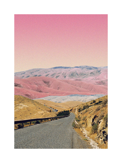 Technicolor scenic landscape with pink and purple mountains under a pink sky.