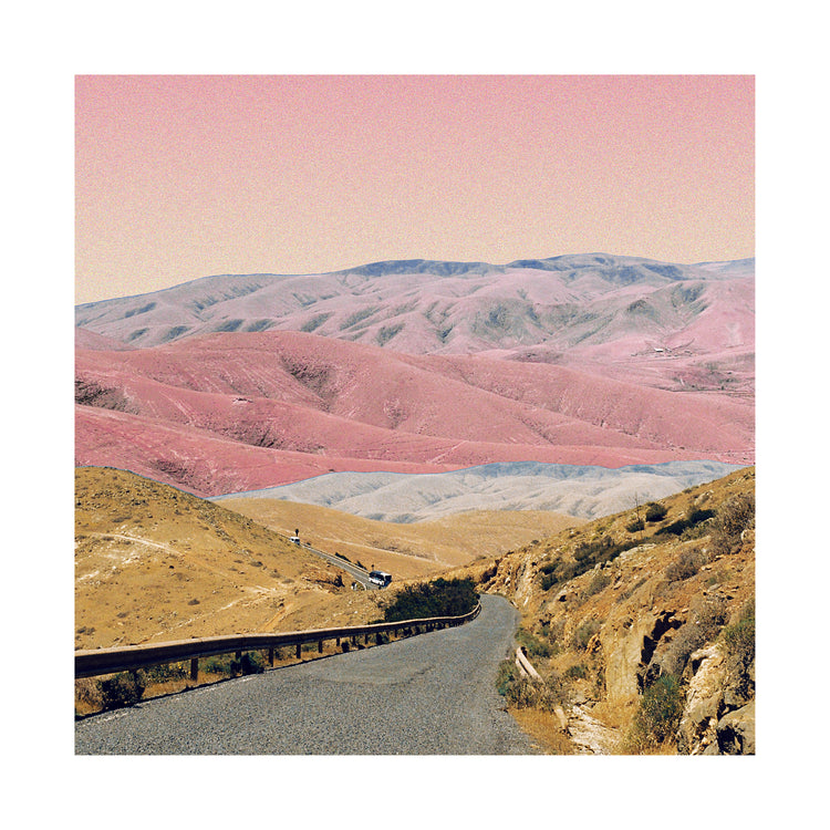 Technicolor scenic landscape with pink and purple mountains under a pink sky.