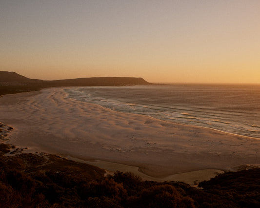 Shoreline during low tide captured at sunset.