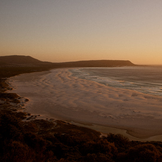 Shoreline during low tide captured at sunset.