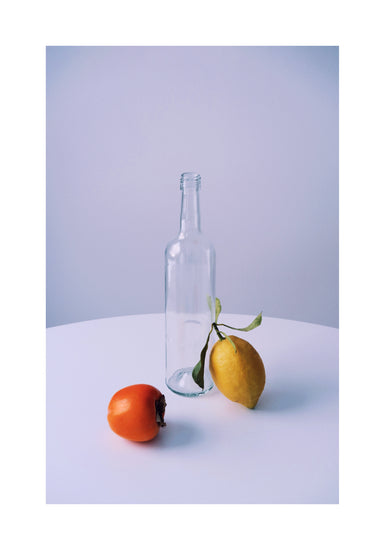 Photo of still life set up of fruits and a bottle looking like a painting.