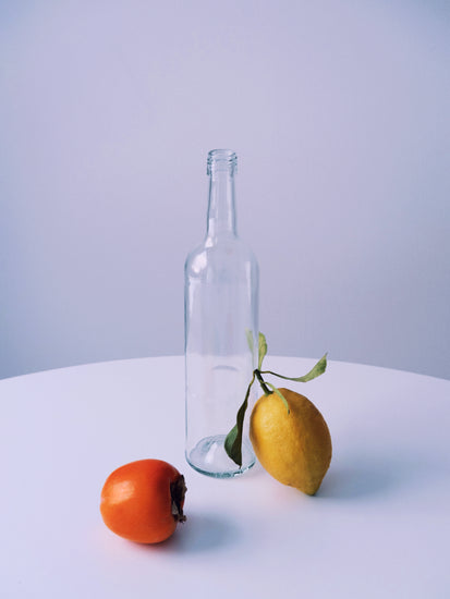 Photo of still life set up of fruits and a bottle looking like a painting.
