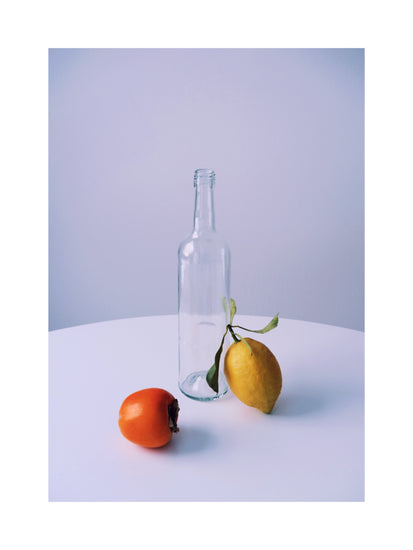 Photo of still life set up of fruits and a bottle looking like a painting.