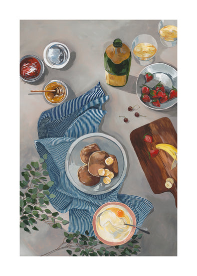 A flat lay illustration from the Breakfast of Champions Poster showcasing fluffy pancakes with banana slices, surrounded by honey, jam, a striped cloth, a wooden board with bananas and strawberries, drink glasses with sparkling champagne, and leafy branches.