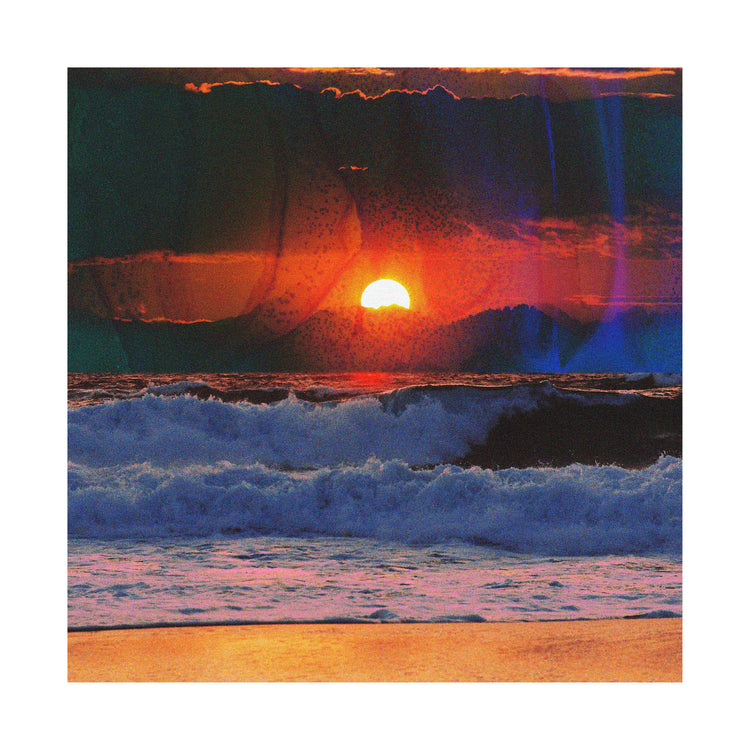 Waves crashing on the shore illuminated by a golden sunset on a cloudy sky.