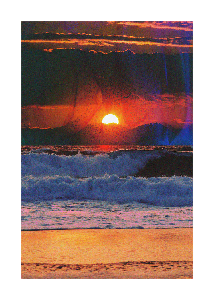 Waves crashing on the shore illuminated by a golden sunset on a cloudy sky.
